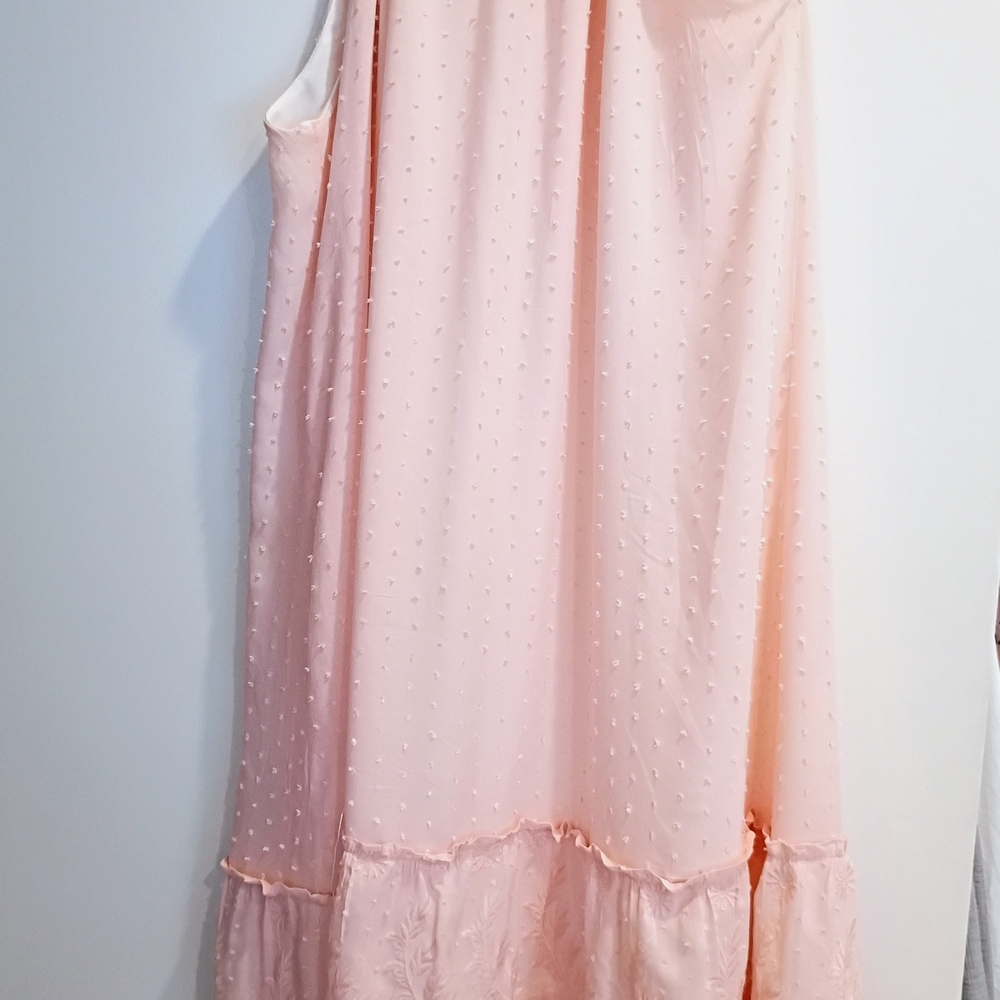 Renee C. Cream Tag with Orange and Silver Accents
